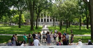 Group of people standing in Harvard yard in summer