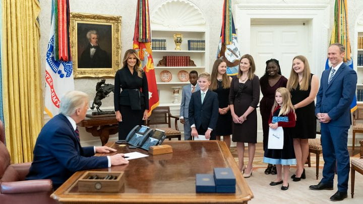 Amy Coney Barrett with her family, President Trump, and First Lady Melania Trump in the Oval Office